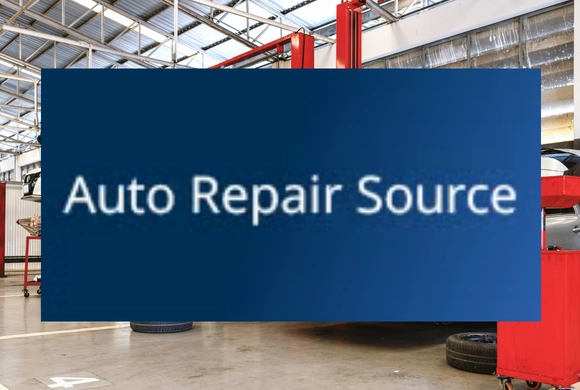 Photo of an auto repair shop with a blue box in the centre containing the text "Auto Repair Source".